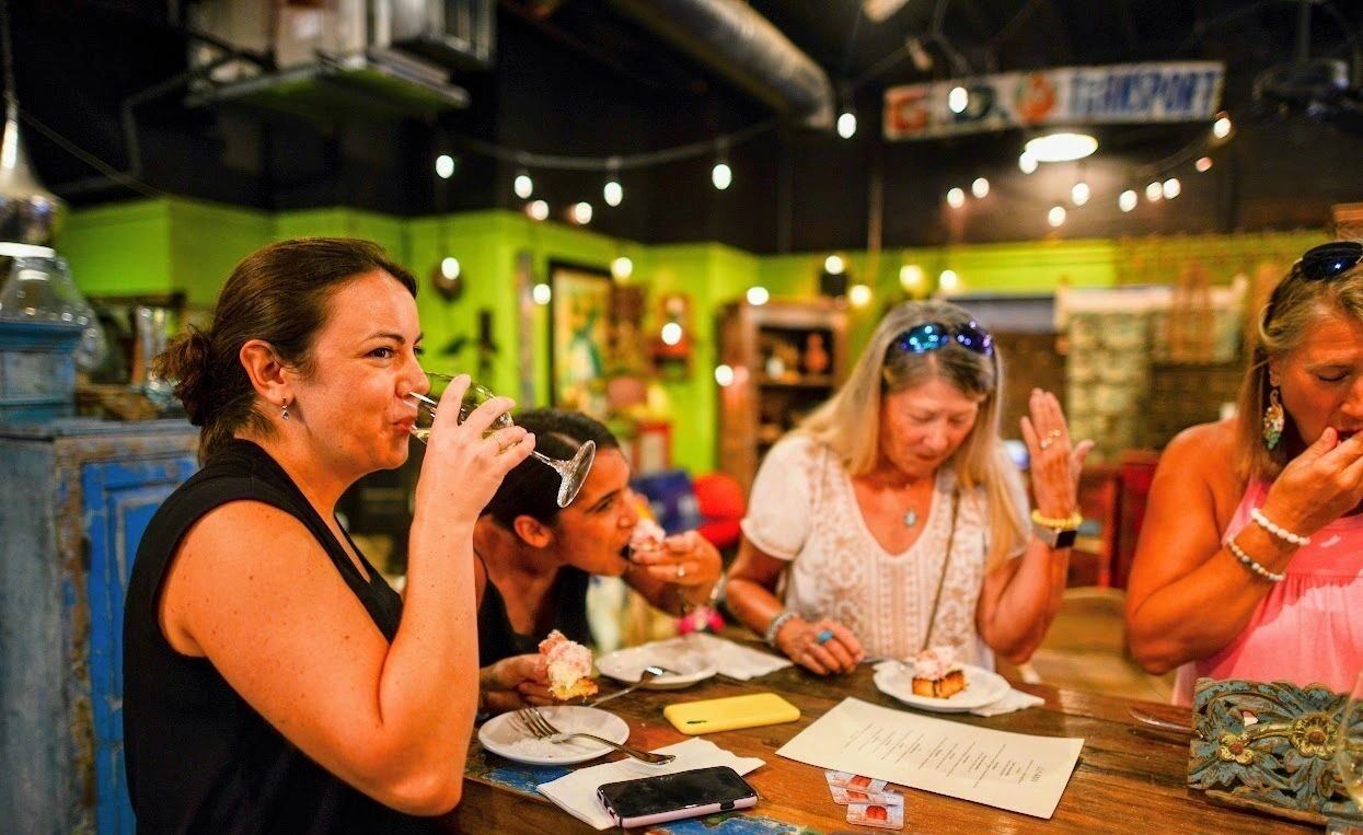 a group of women food tasting