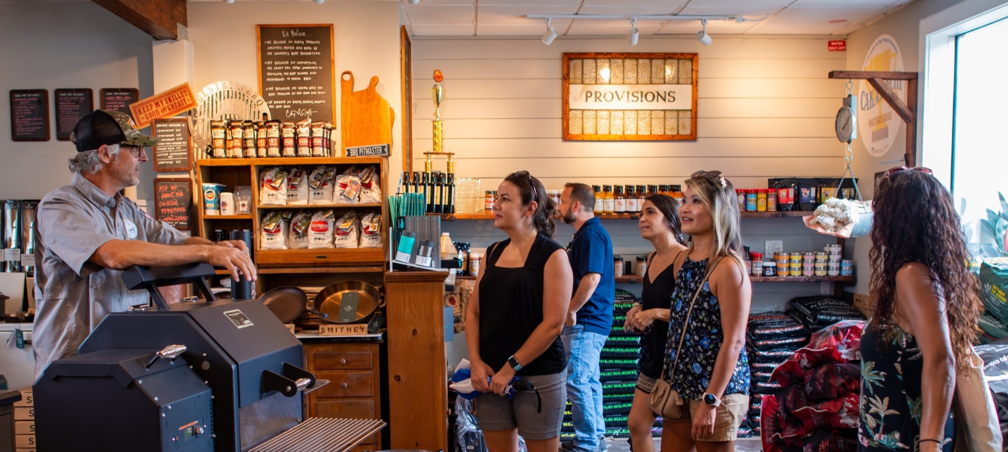 a group of people standing in front of a store