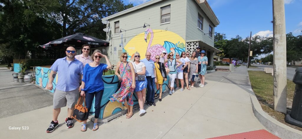 a group of people on a sidewalk
