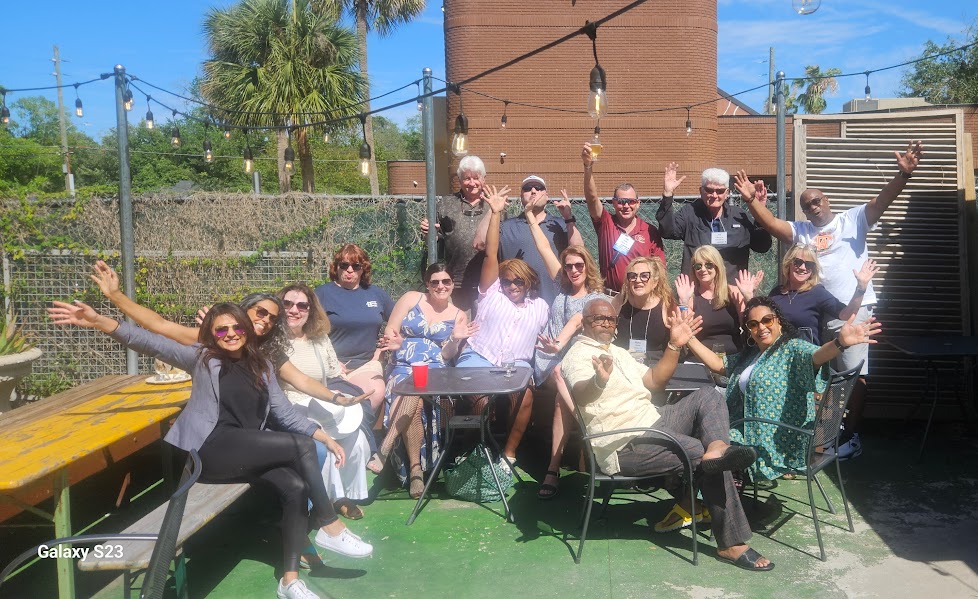 a group of people sitting posing for the camera