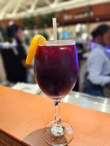 a close up of a wine glass sitting on a table